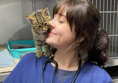 veterinary nurse with kitten on shoulder
