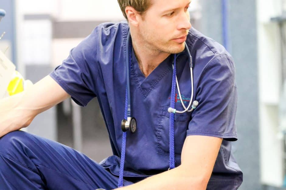 vet crouching in thought